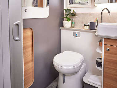 adamo-69-4-rear-washroom-with-sliding-door-access-to-garage-storage.jpg